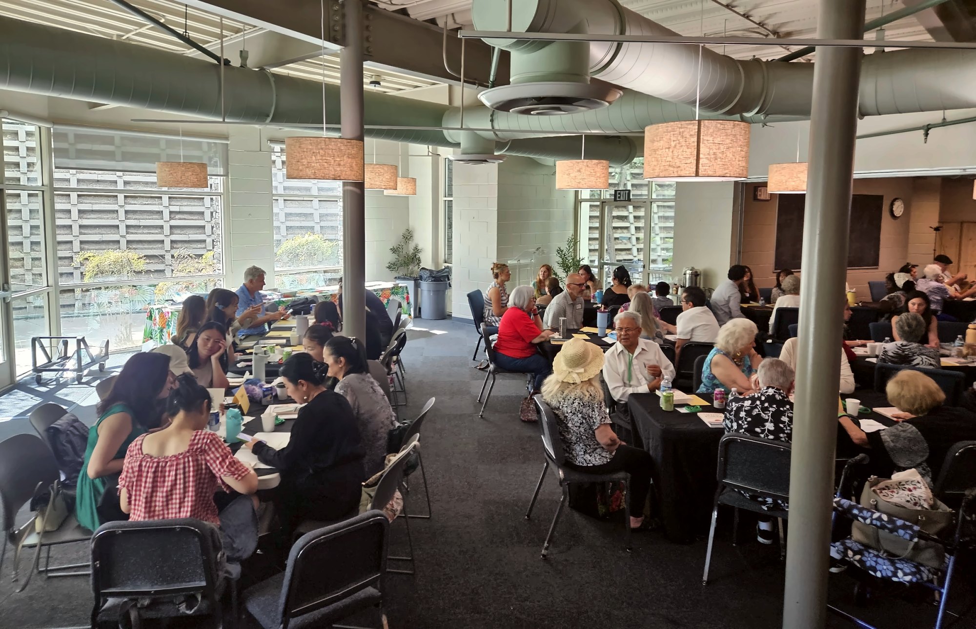 Becomers gathered at tables on launch day